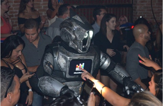 Guests interacting with the Deezer robot activation